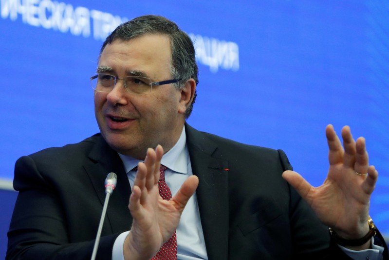 FILE PHOTO: Total CEO Pouyanne attends a session of the St. Petersburg International Economic