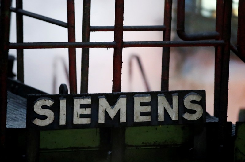 FILE PHOTO: A sign of Germany's industrial group Siemens AG is pictured at a primary rolling