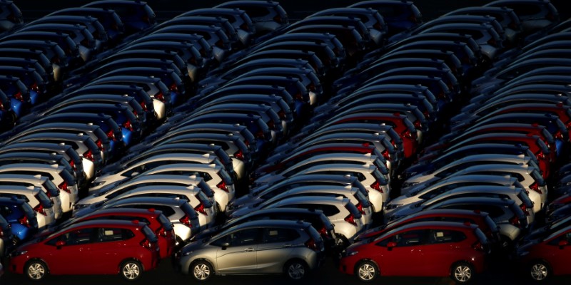 FILE PHOTO:  Newly manufactured cars await export at port in Yokohama