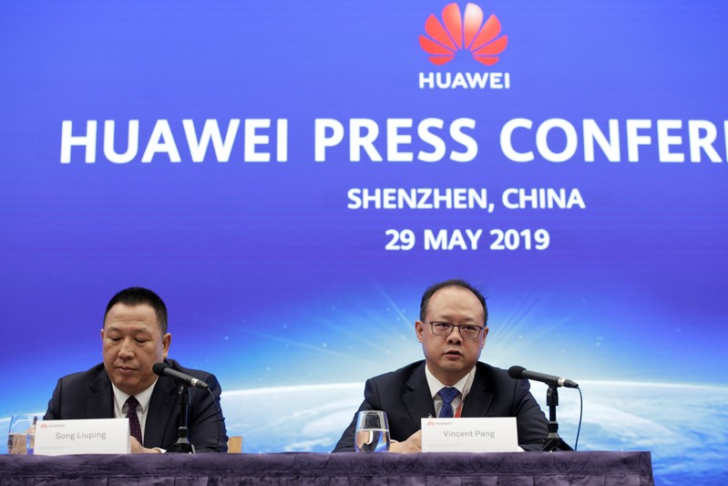 Huawei's Chief Legal Officer Song Liuping ( L) and Huawei's Western Europe President Vincent