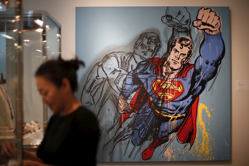FILE PHOTO: A woman stands in front of Andy Warhol's 