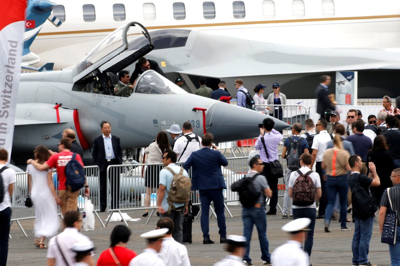 Visitors look at J-F 17  Thunder fighter on static display during the 53rd International Paris