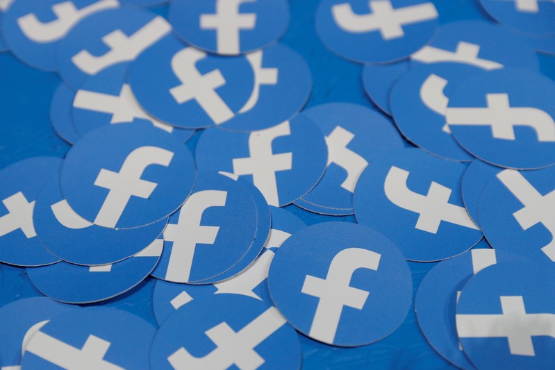 FILE PHOTO: Stickers bearing the Facebook logo are pictured at Facebook Inc's F8 developers