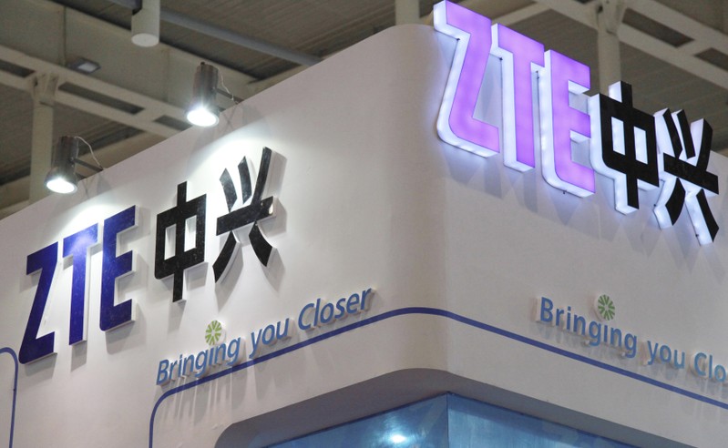 ZTE company logos are seen at an international software and information services exhibition in