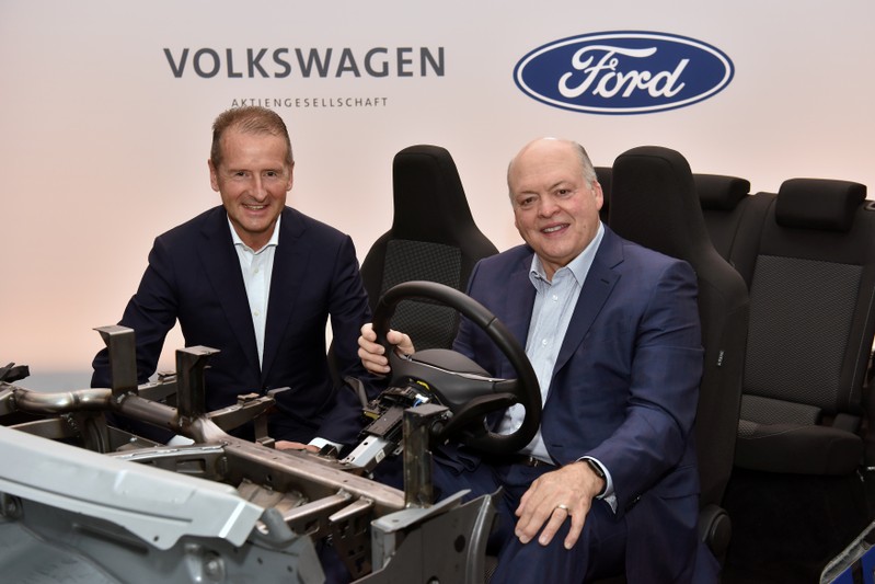 Volkswagen CEO Herbert Diess and Ford President and CEO Jim Hackett appear in a prototype