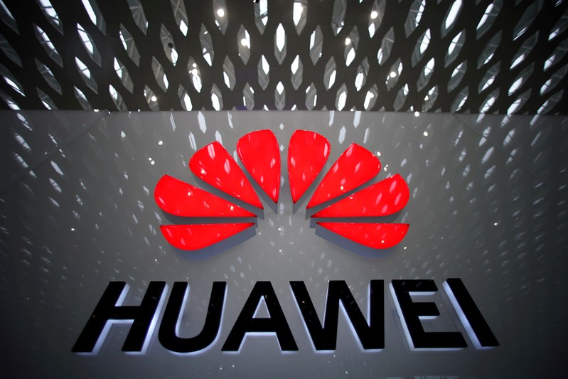 FILE PHOTO: A Huawei company logo is pictured at the Shenzhen International Airport in Shenzhen