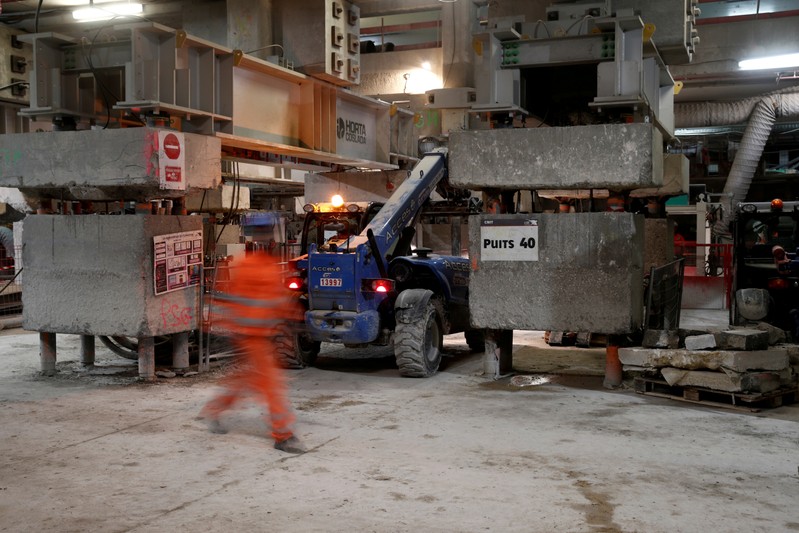 FILE PHOTO: Labourer works on the construction site of the Eole project near Paris