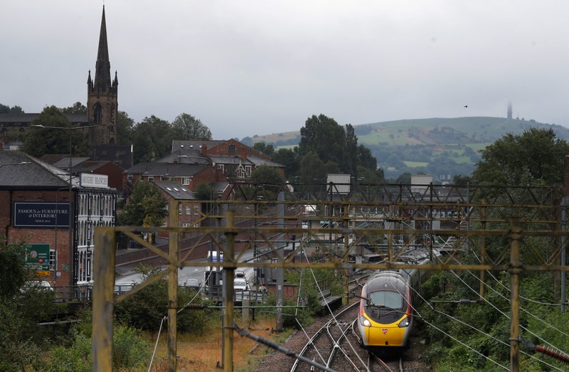 A Virgin Trains West Coast Mainline service from London to Manchester pulls out of the station