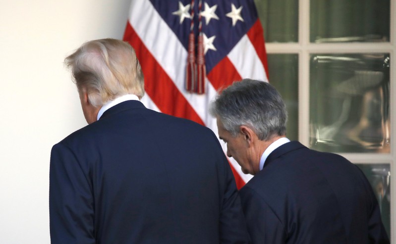 FILE PHOTO: U.S. President Donald Trump leaves the Rose Garden with Jerome Powell, his nominee