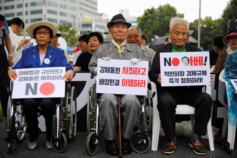 Lee Choon-shik, a victim of wartime forced labor during the Japanese colonial period, holds a