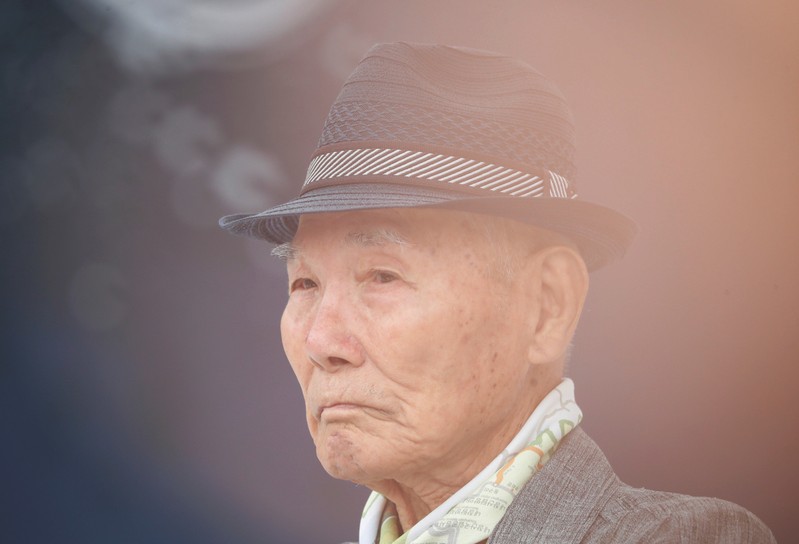 Lee Choon-shik, a victim of wartime forced labor during the Japanese colonial period, reacts as