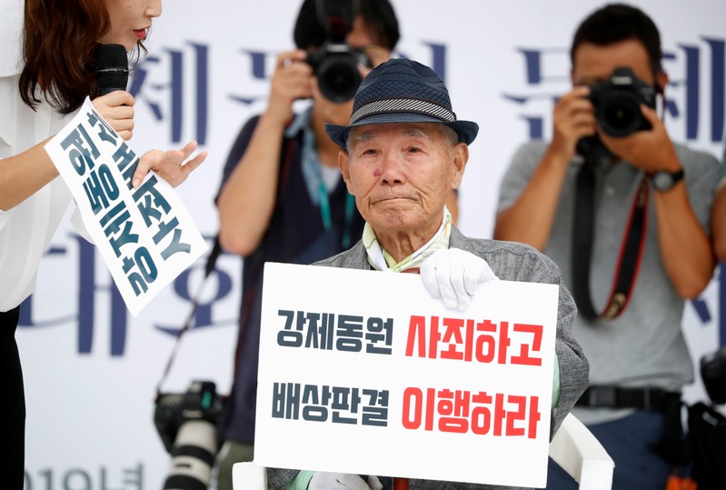 Lee Choon-shik, a victim of wartime forced labor during the Japanese colonial period, reacts as