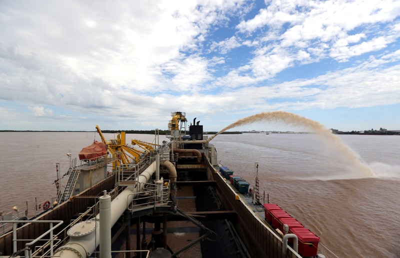 FILE PHOTO: A dredging boat sprays sand at the shore on the Parana river near Rosario,