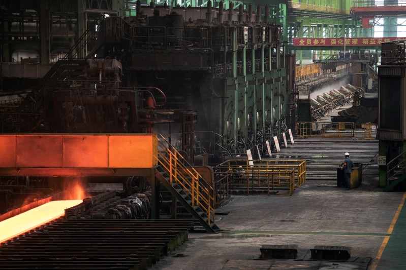 Worker is seen at a hot rolling production line at the Chongqing Iron and Steel plant in