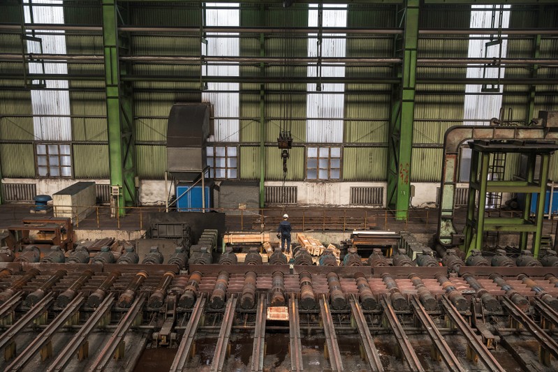 Worker is seen at a hot rolling production line at the Chongqing Iron and Steel plant in