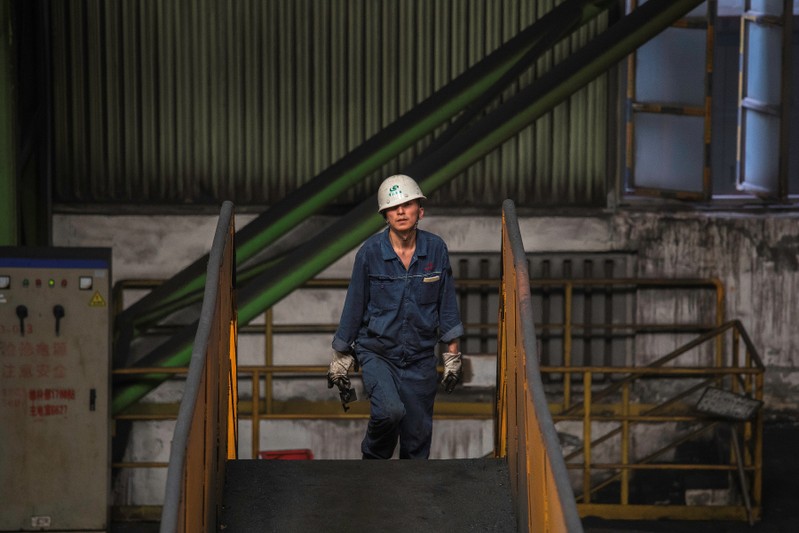 Worker walks at the Chongqing Iron and Steel plant in Changshou