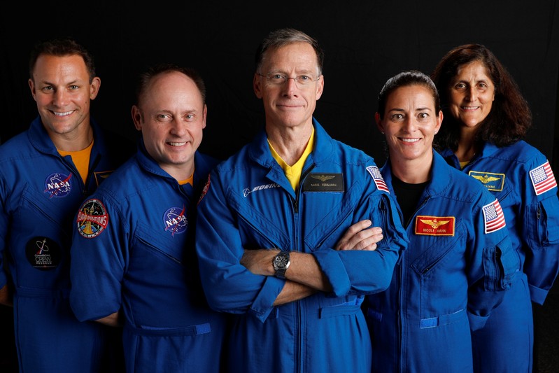 Boeing astronaut Chris Ferguson poses for a picture with NASA commercial crew astronauts