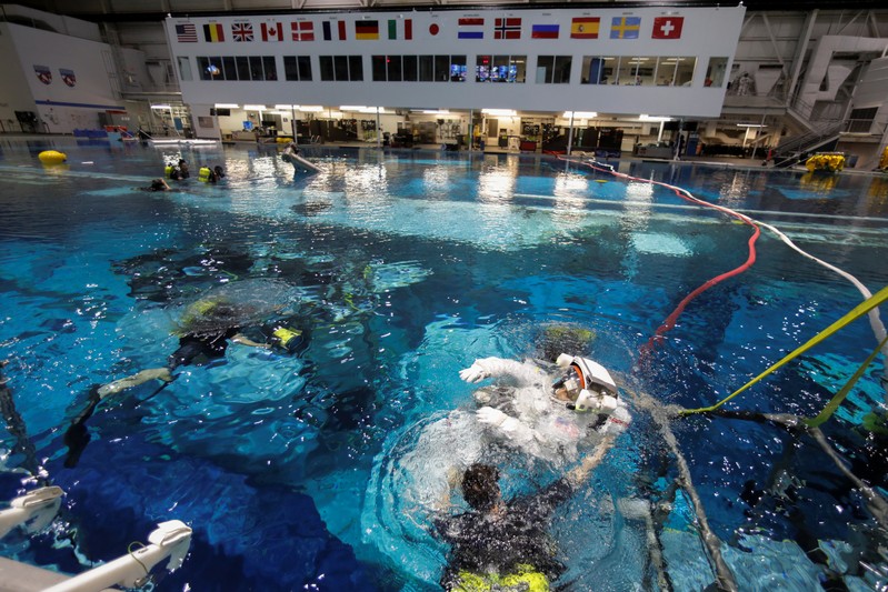 NASA Commercial Crew astronaut Sunita Williams enters the water at NASA's Neutral Buoyancy