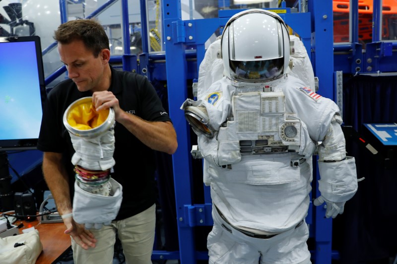 NASA Commercial Crew Astronaut Josh Cassada goes through a space suit fitting session at the