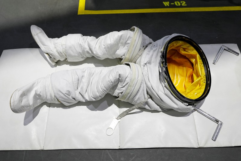 The space suit pants of the NASA Commercial Crew Astronaut Josh Cassada are seen on a pool desk