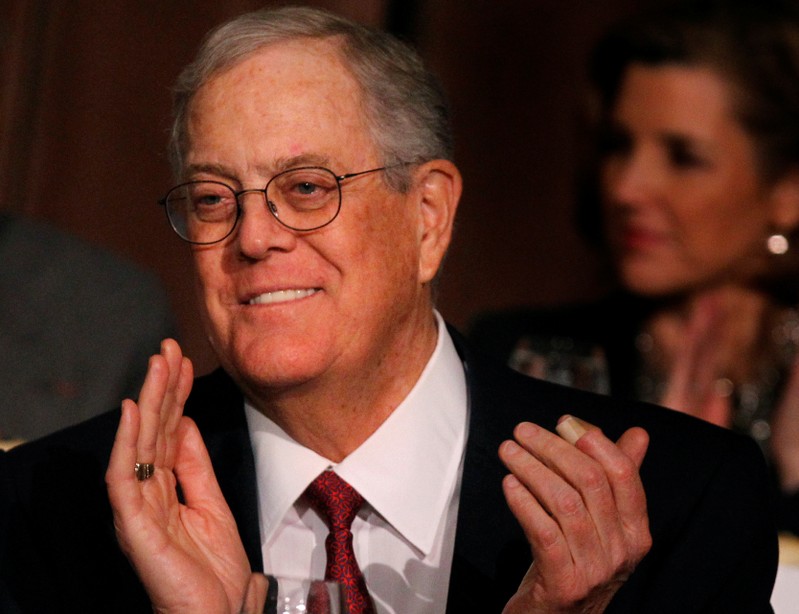 FILE PHOTO: David Koch, executive vice president of Koch Industries, applauds during an