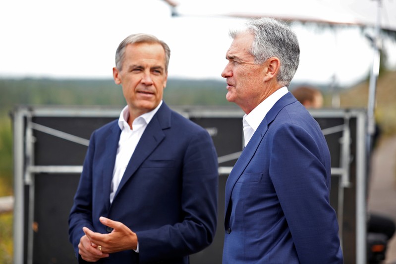 Federal Reserve Chair Jerome Powell and Governor of the Bank of England, Mark Carney chat