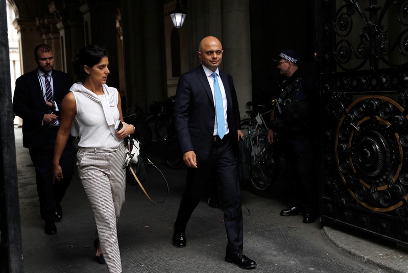 Britain's Chancellor of the Exchequer Sajid Javid walks into Downing Street in London