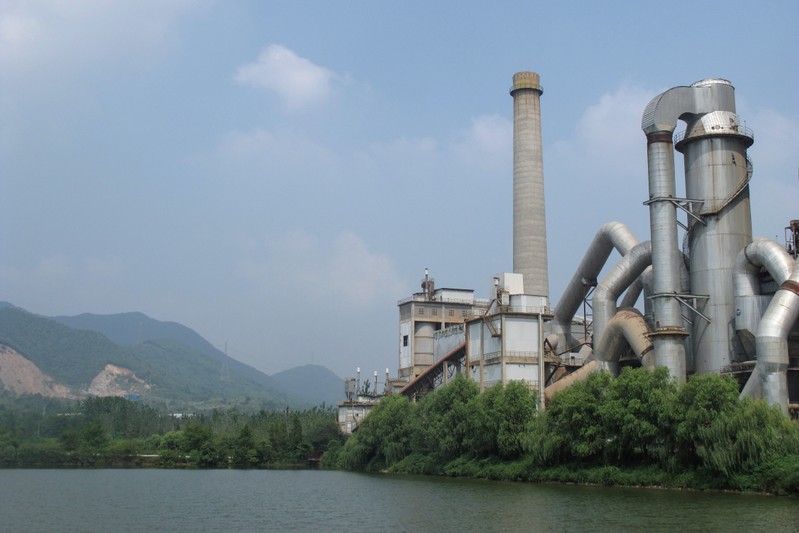 Anhui Conch cement plant is seen by a river in Tongling