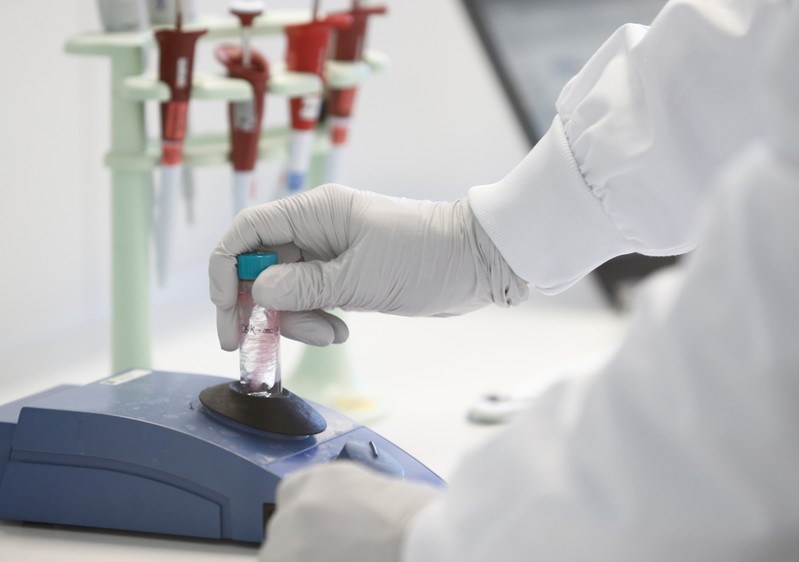 A staff works in a laboratory during a media visit for the inauguration of the Nestle Institute