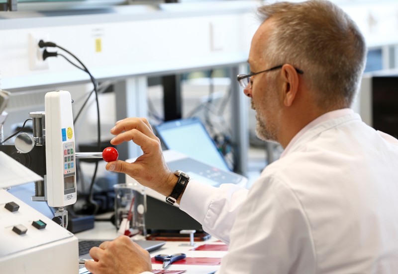 A staff works in a laboratory during a media visit for the inauguration of the Nestle Institute