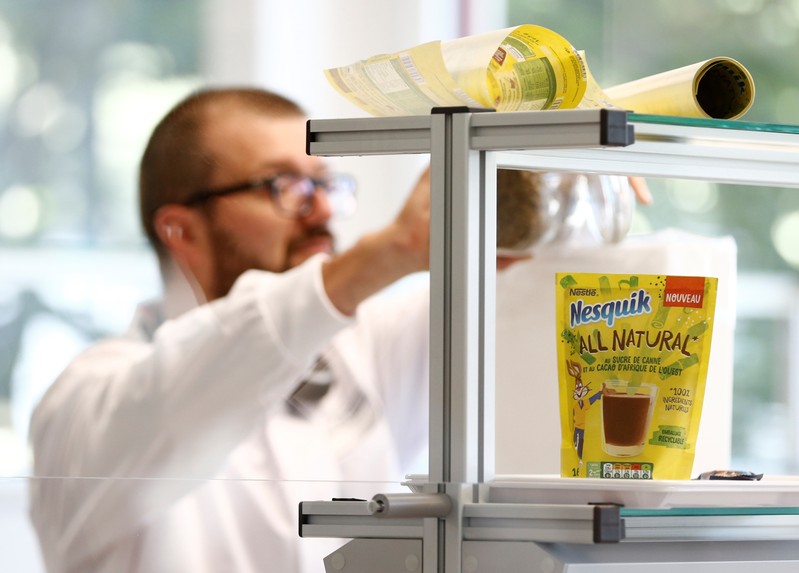 A staff works in a laboratory during a media visit for the inauguration of the Nestle Institute