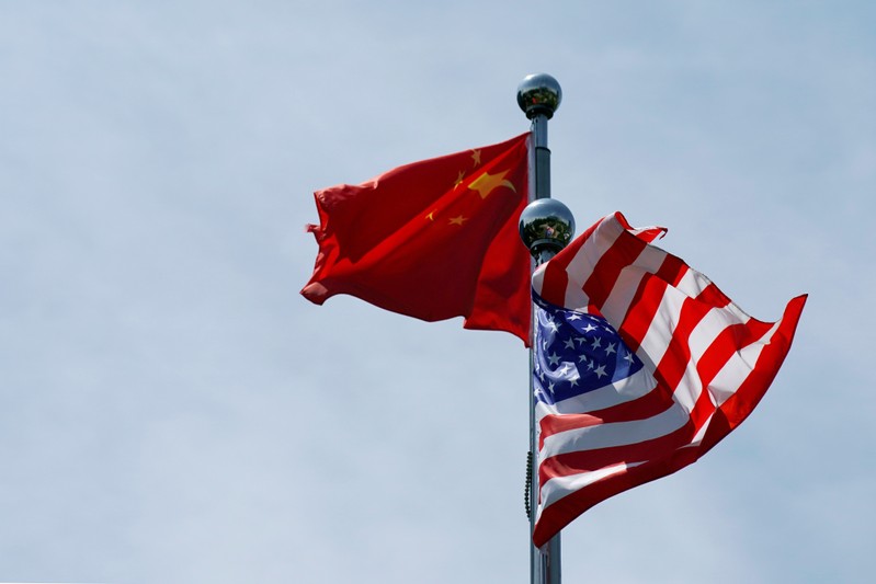 FILE PHOTO: FILE PHOTO: FILE PHOTO: Chinese and U.S. flags flutter near The Bund in Shanghai