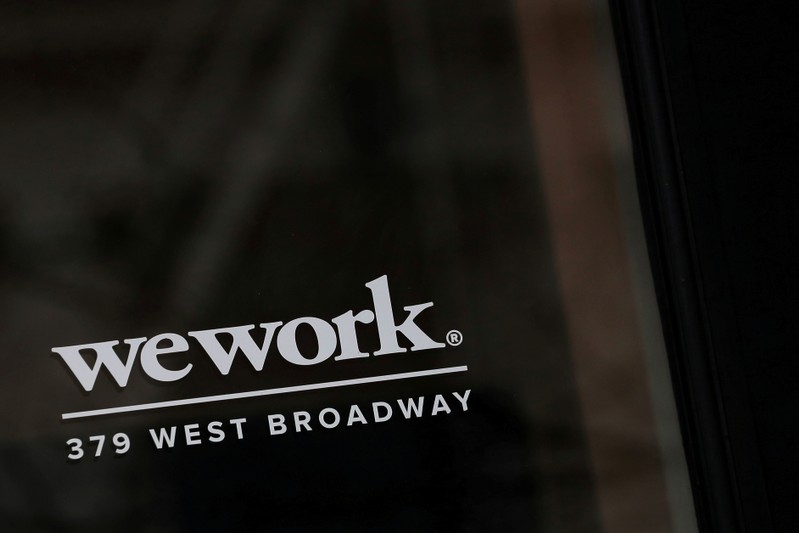 FILE PHOTO: The WeWork logo is displayed on the entrance of a co-working space in New York