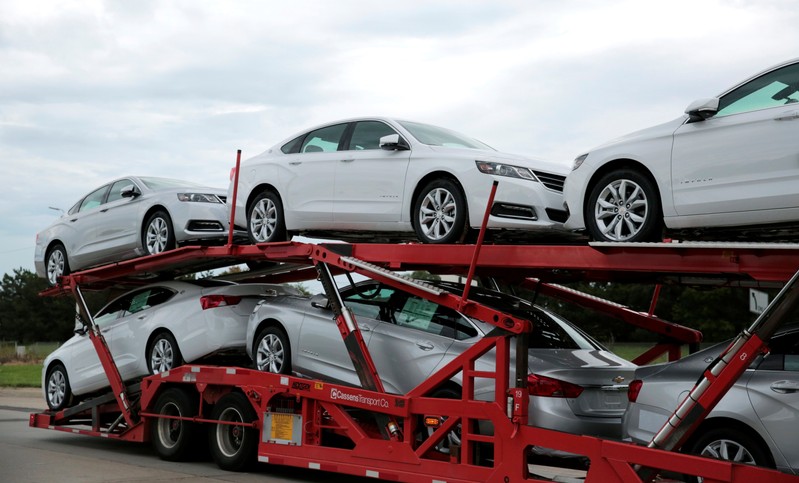 Car hauler transports newly built Chevrolet Impalas from the General Motors Detroit-Hamtramck