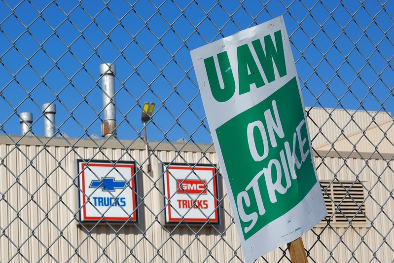 A union strike sign is stuck in the fence outside the GM Flint Truck Assembly in Flint