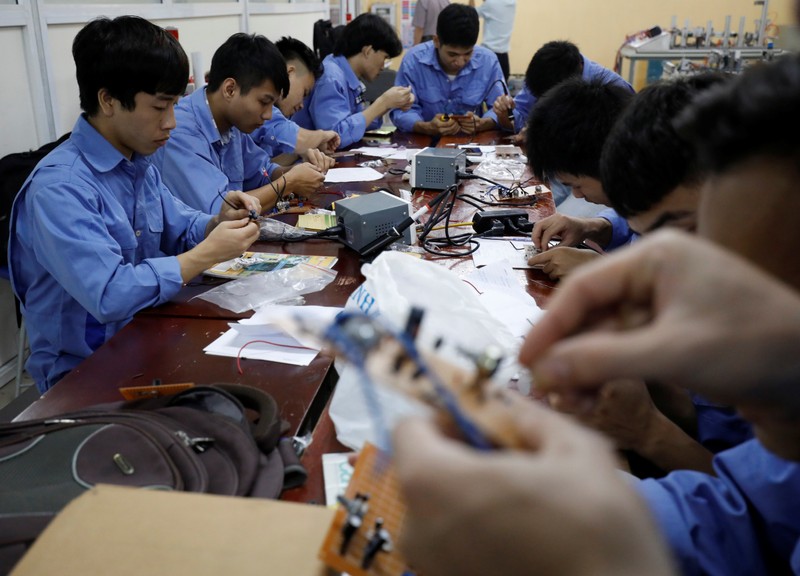 Students practise at a lab of an industrial vocational training college in Hanoi