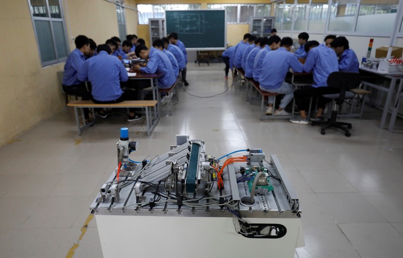 Students practise at a lab of an industrial vocational training college in Hanoi