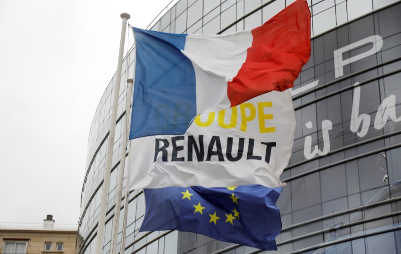 French, EU and Renault flags flutter in front of French carmaker Renault headquarters ahead of