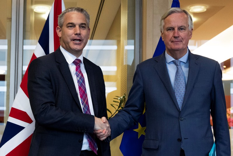 Britain's Brexit Secretary Barclay poses with EU's chief Brexit negotiator Barnier in Brussels