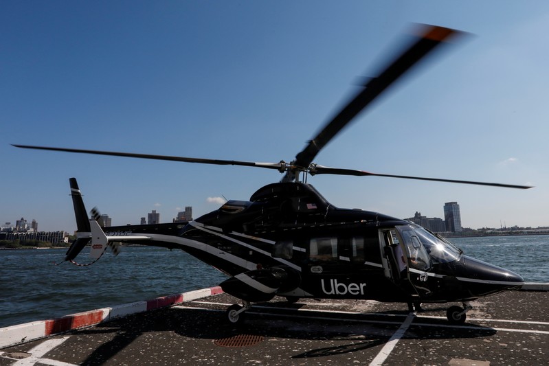 FILE PHOTO: A helicopter operated by Uber Copter, a new service by the ride-sharing company