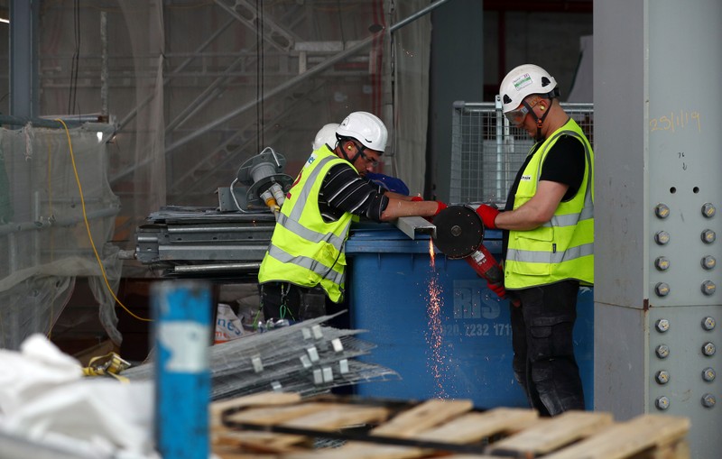 Workers are seen at the construction site of 22 Bishopsgate in London