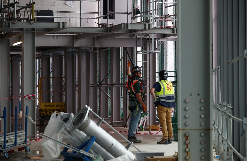 Workers are seen at the construction site of 22 Bishopsgate in London