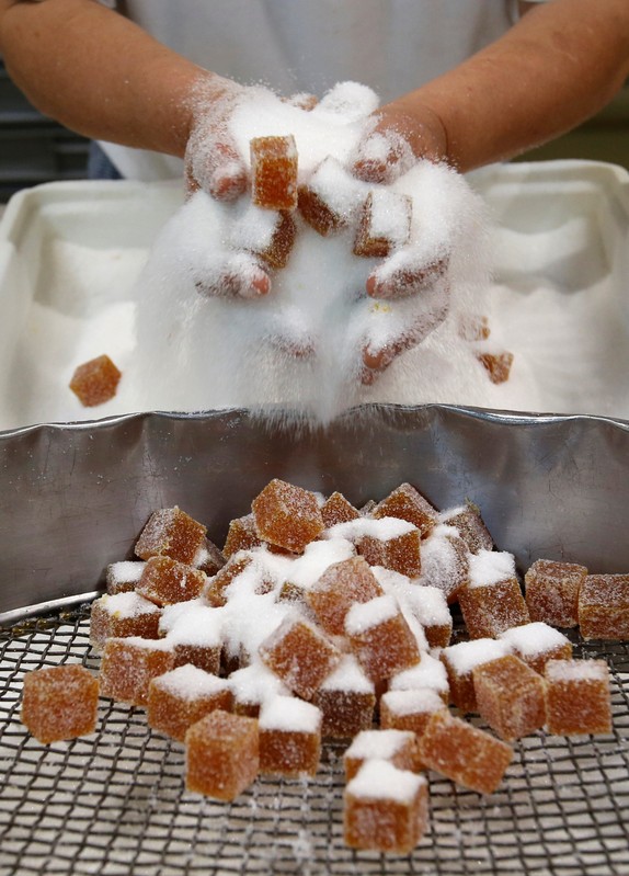 A worker prepares fruit jelly for export at the Cruzilles factory in Clermont-Ferrand