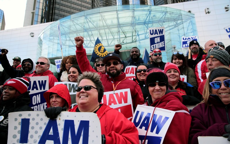 Striking United Auto Workers (UAW) members rally in front of General Motors World headquarters