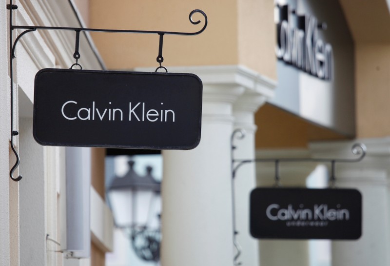 Boards with Calvin Klein store logo are seen on a shopping center at the outlet village Belaya