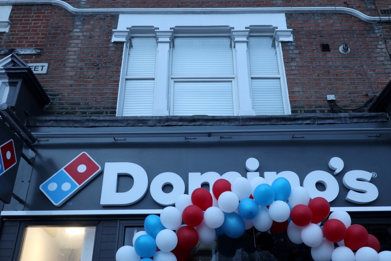 FILE PHOTO: Balloons are seen on the front of a newly opened Domino's Pizza franchise in