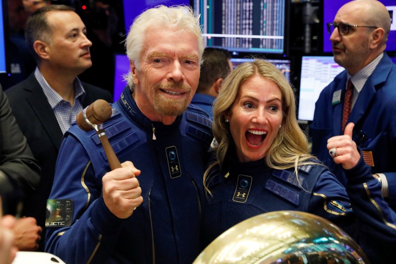 Sir Richard Branson poses on floor of New York Stock Exchange with Future space traveller