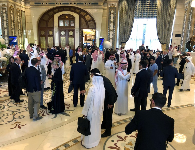 Participants take a break during the Future Investment Initiative conference in Riyadh