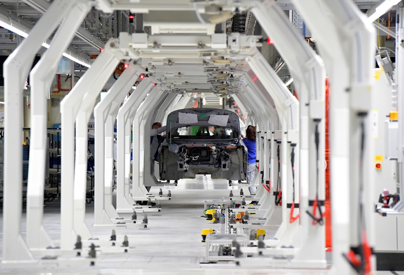 Employees work at a production line of a a new electric Volkswagen model ID.3 in Zwickau