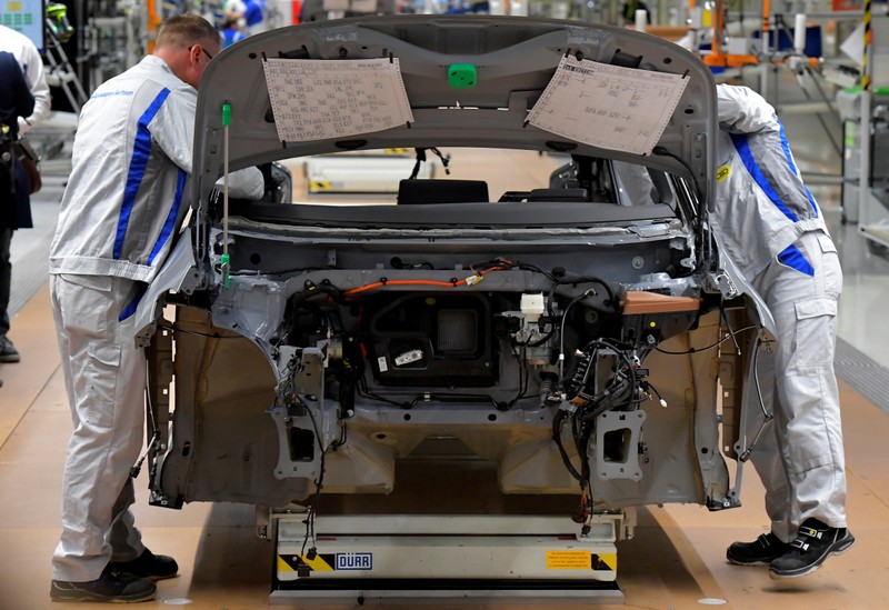 Employees work at a production line of a a new electric Volkswagen model ID.3 in Zwickau